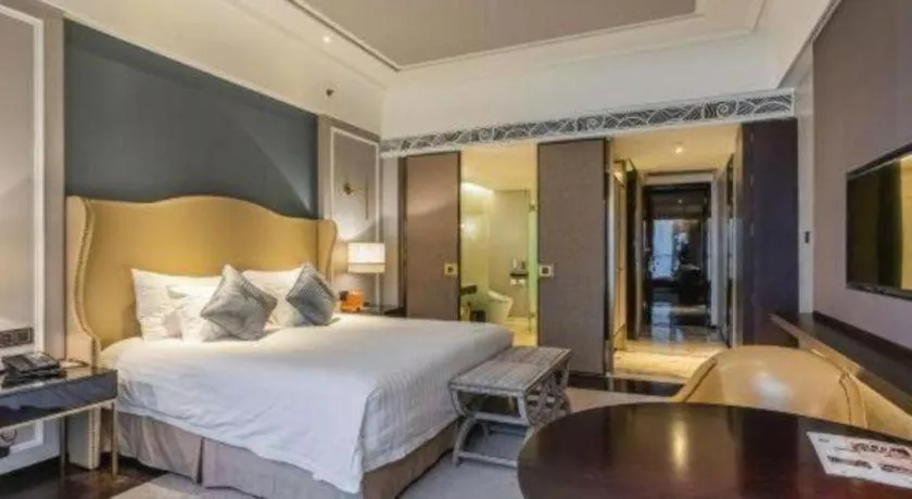 Bed in Grand New Century Hotel Yixing