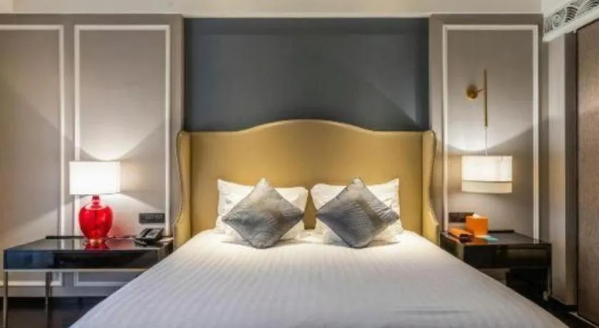 Bed in Grand New Century Hotel Yixing