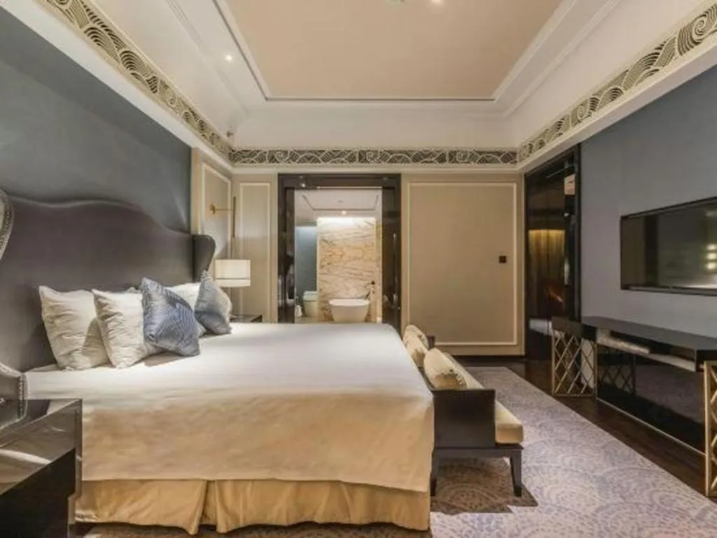 Bed in Grand New Century Hotel Yixing