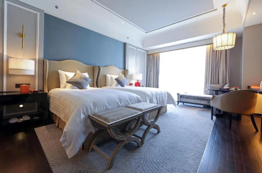 Bed in Grand New Century Hotel Yixing