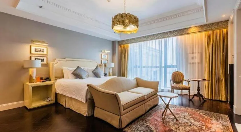Bed in Grand New Century Hotel Yixing