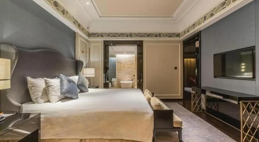 Bed in Grand New Century Hotel Yixing