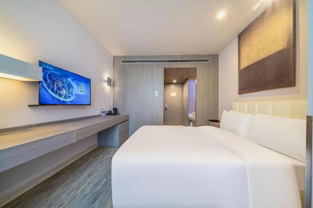 Bed in Jinjiang Metropolo Hotel Hangzhou Xiasha Jinsha Lake