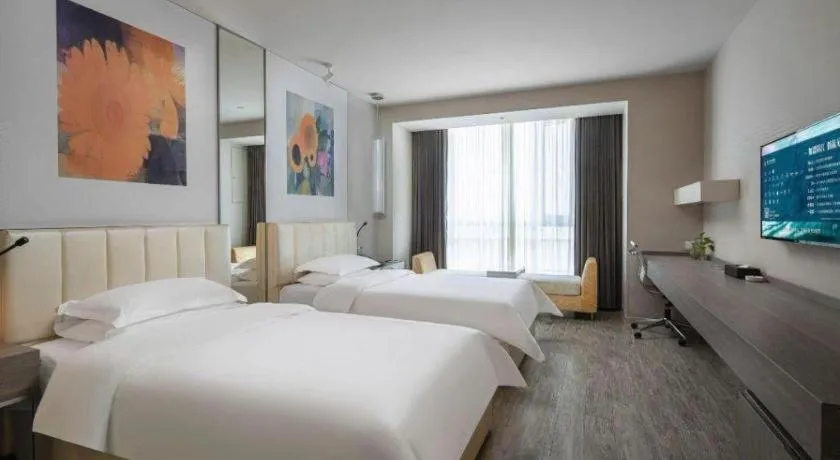 Bed in Jinjiang Metropolo Hotel Hangzhou Xiasha Jinsha Lake