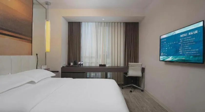 Bed in Jinjiang Metropolo Hotel Hangzhou Xiasha Jinsha Lake