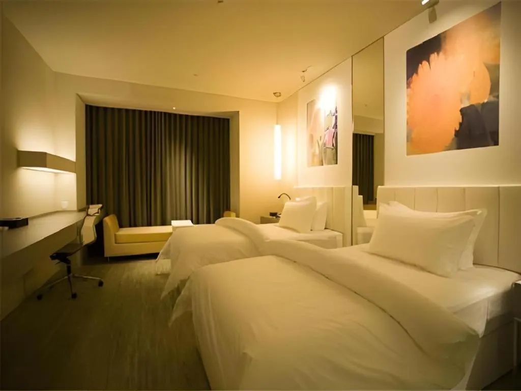 Bed in Jinjiang Metropolo Hotel Hangzhou Xiasha Jinsha Lake