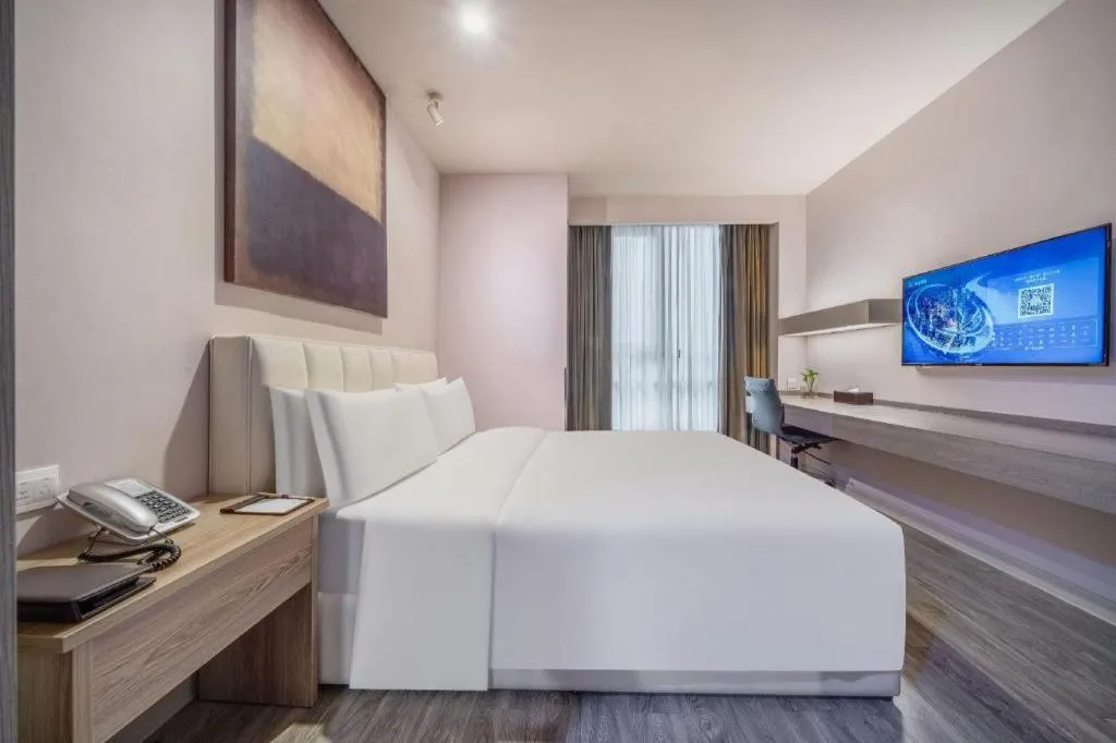 Bed in Jinjiang Metropolo Hotel Hangzhou Xiasha Jinsha Lake