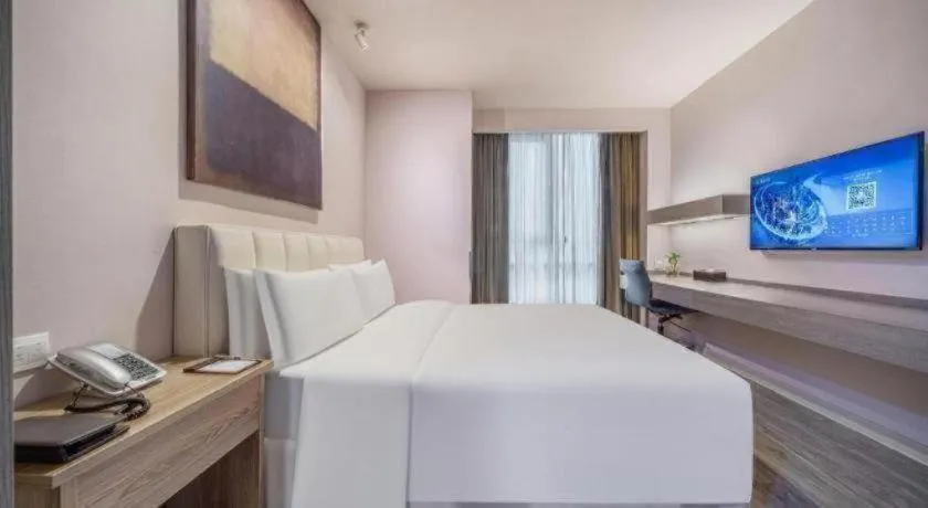 Bed in Jinjiang Metropolo Hotel Hangzhou Xiasha Jinsha Lake