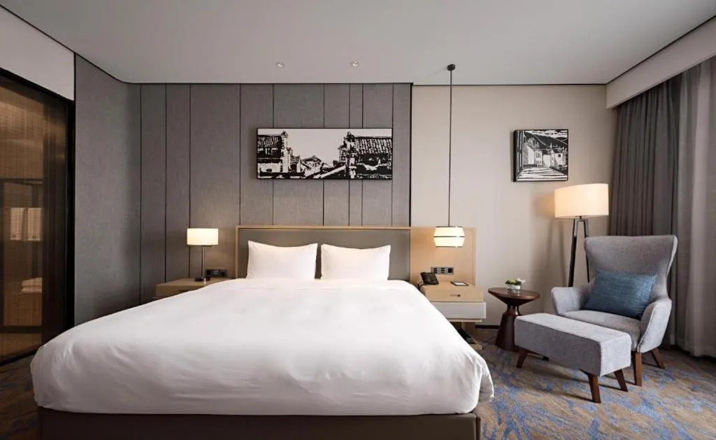 Bed in Zhuhai Tangyi Hotel