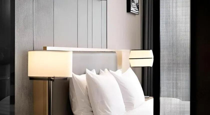 Bed in Zhuhai Tangyi Hotel