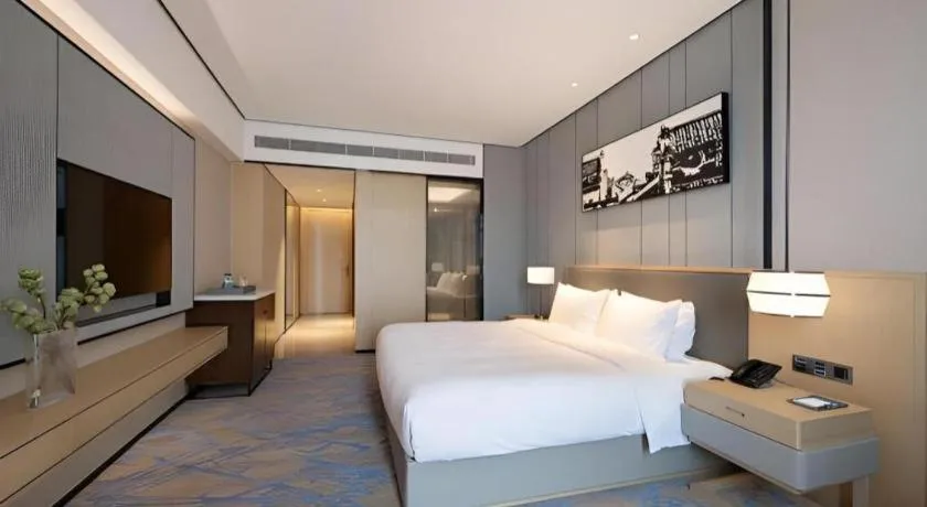 Bed in Zhuhai Tangyi Hotel