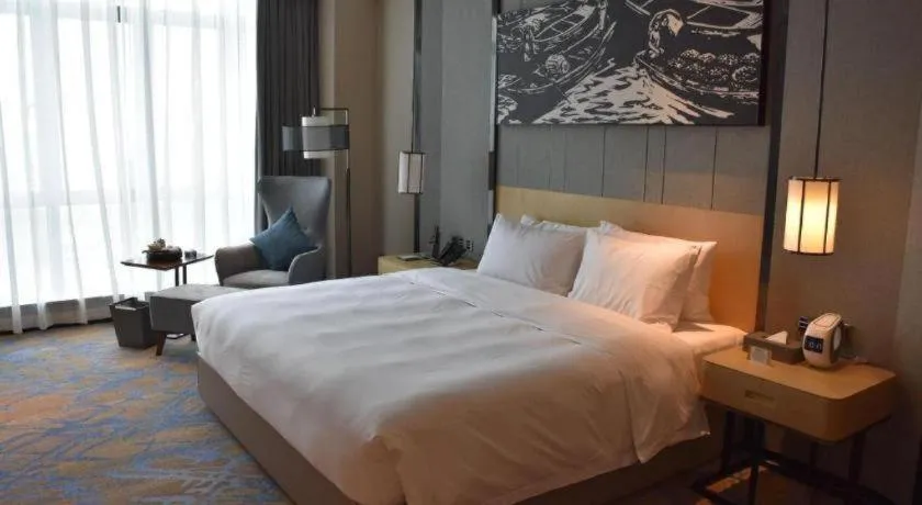 Bed in Zhuhai Tangyi Hotel