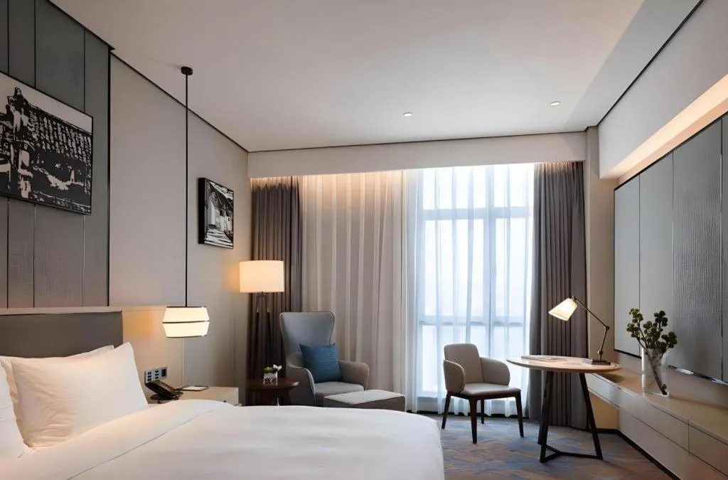 Bed in Zhuhai Tangyi Hotel