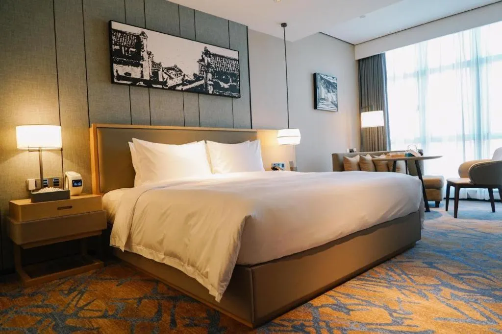 Bed in Zhuhai Tangyi Hotel