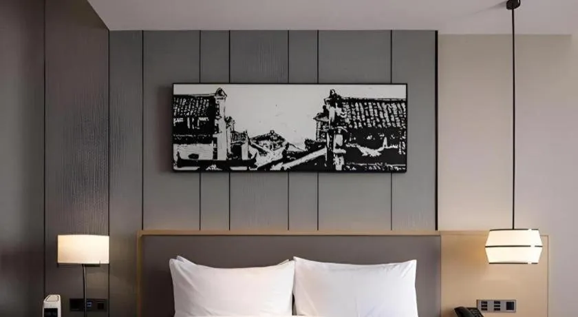 Bed in Zhuhai Tangyi Hotel