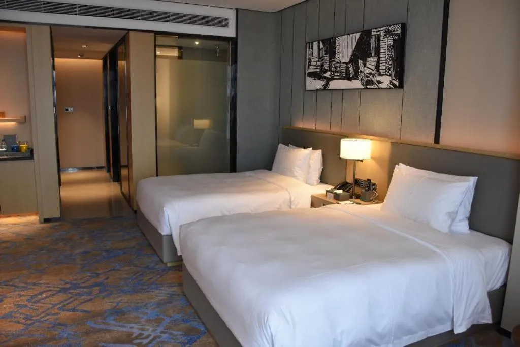 Bed in Zhuhai Tangyi Hotel