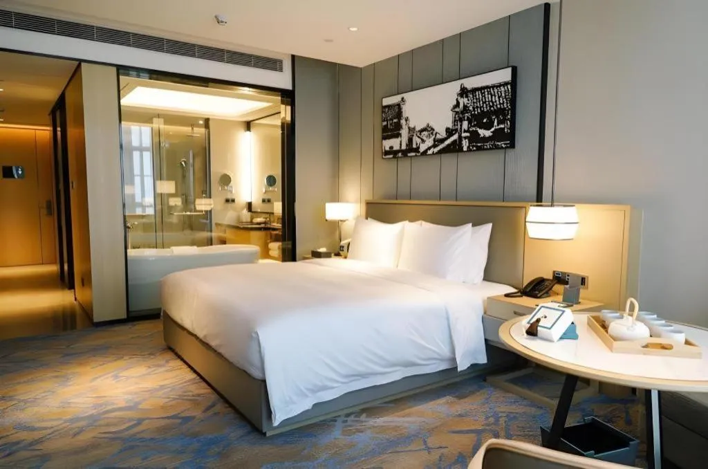 Bed in Zhuhai Tangyi Hotel