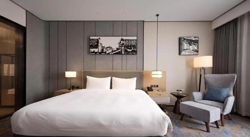 Bed in Zhuhai Tangyi Hotel