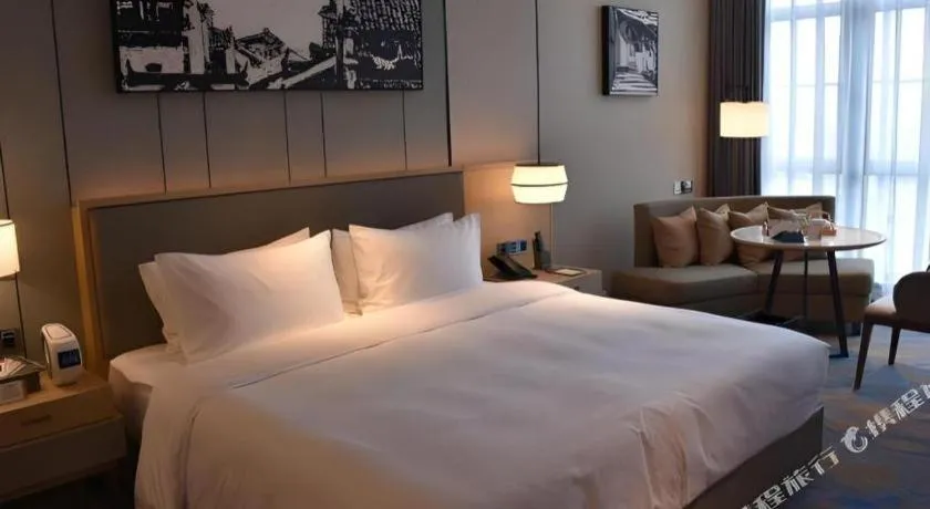 Bed in Zhuhai Tangyi Hotel