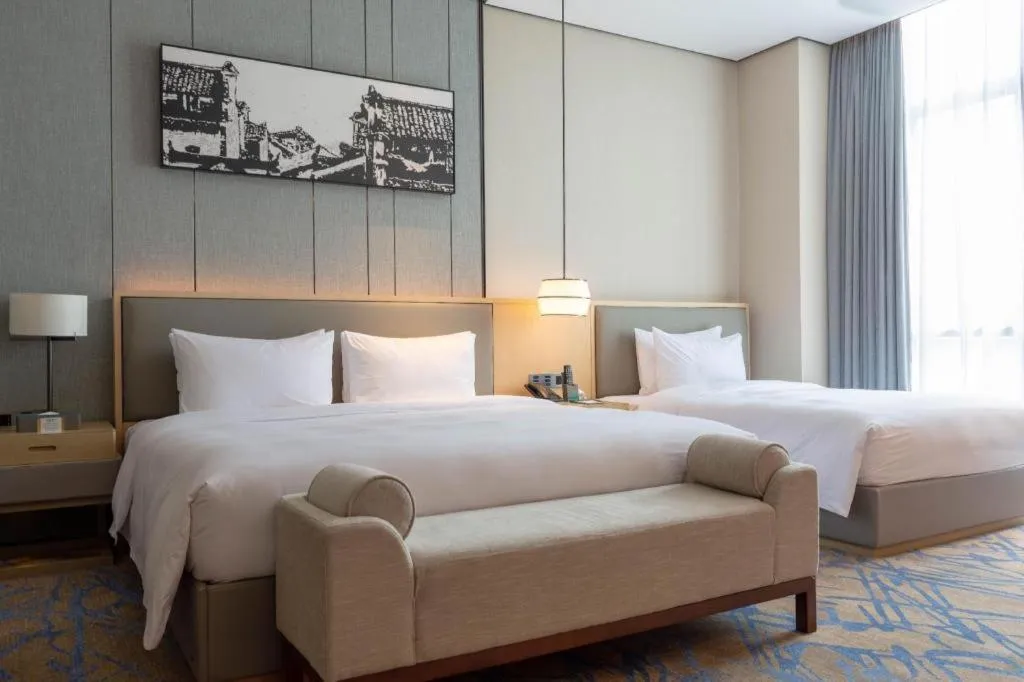 Bed in Zhuhai Tangyi Hotel