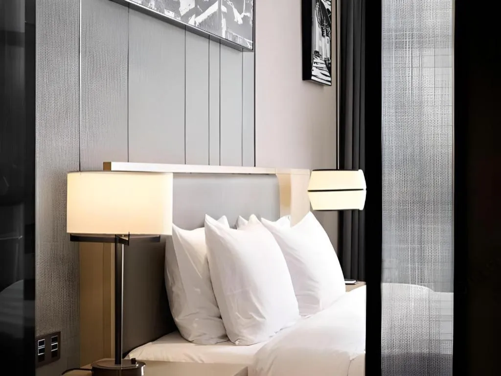 Bed in Zhuhai Tangyi Hotel