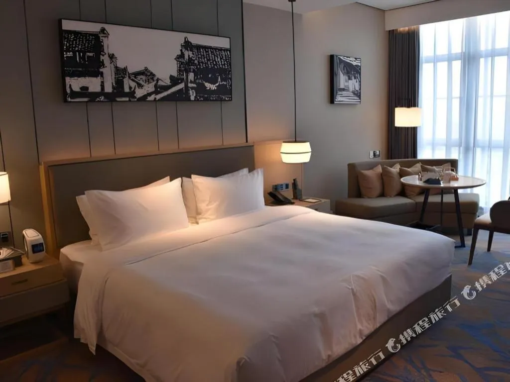 Bed in Zhuhai Tangyi Hotel