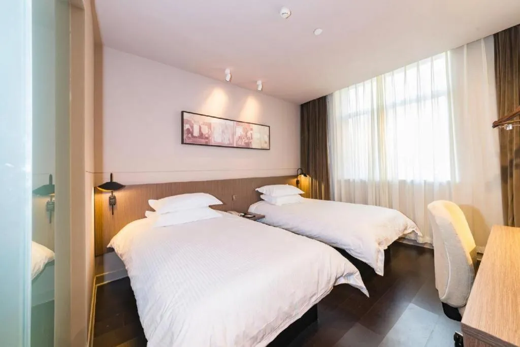 Bed in Jinjiang Inn Select Yancheng Oufeng Hua Street Julong Lake