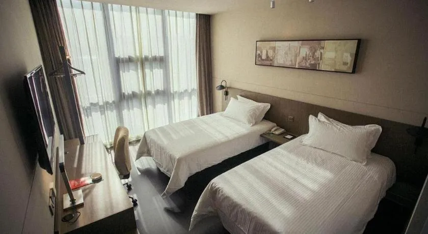Bed in Jinjiang Inn Select Yancheng Oufeng Hua Street Julong Lake