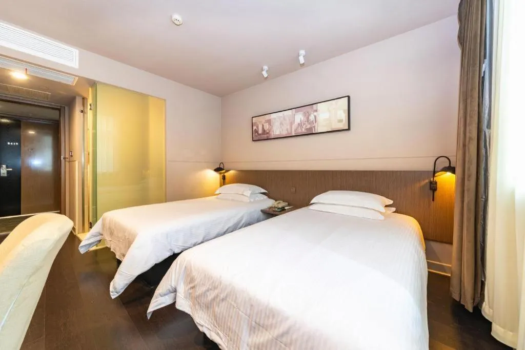 Bed in Jinjiang Inn Select Yancheng Oufeng Hua Street Julong Lake