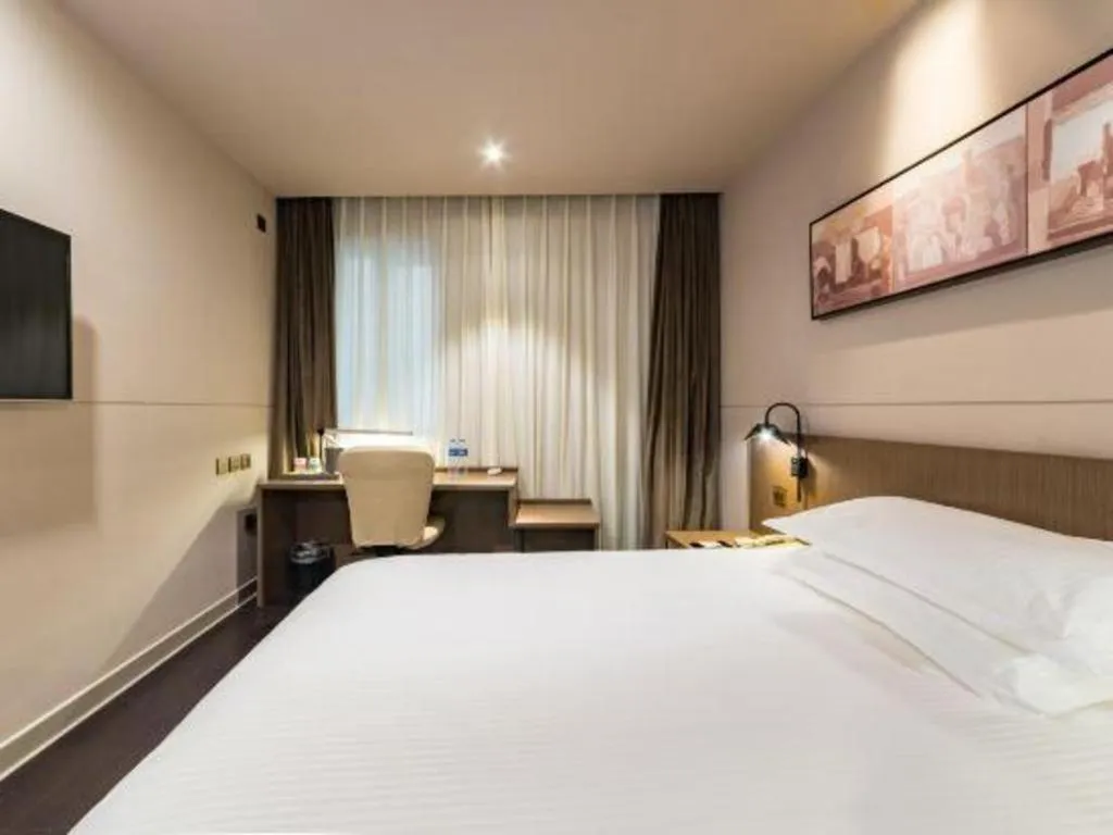 Bed in Jinjiang Inn Select Yancheng Oufeng Hua Street Julong Lake