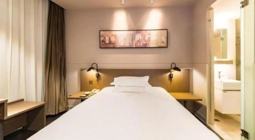 Bed in Jinjiang Inn Select Yancheng Oufeng Hua Street Julong Lake
