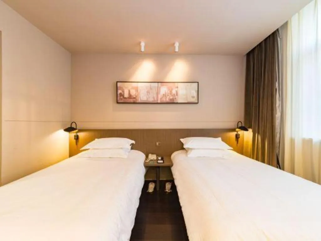 Bed in Jinjiang Inn Select Yancheng Oufeng Hua Street Julong Lake