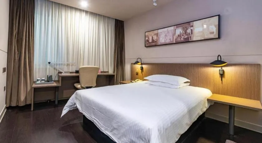 Bed in Jinjiang Inn Select Yancheng Oufeng Hua Street Julong Lake