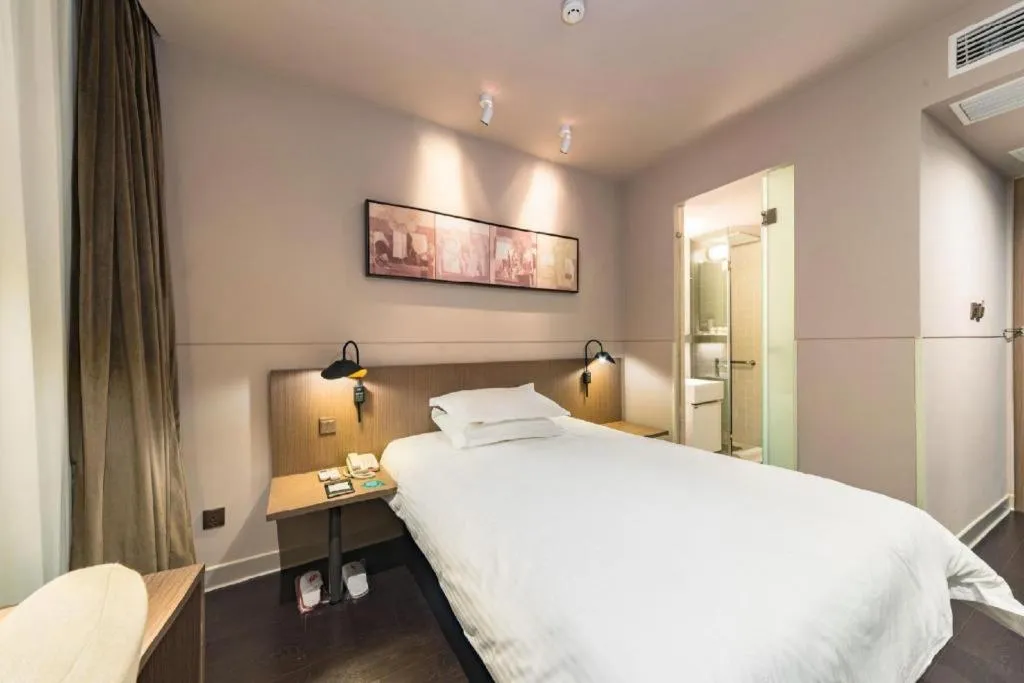 Bed in Jinjiang Inn Select Yancheng Oufeng Hua Street Julong Lake