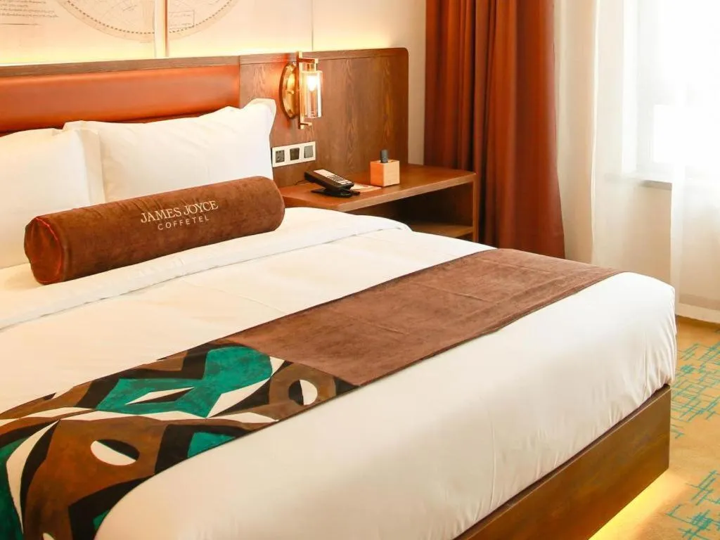 Bed in James Joyce Coffetel Harbin Railway Station Songlei Yuanda Pedestrian Street