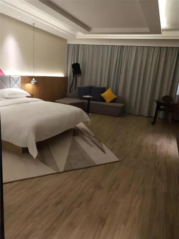 Bed in Borrman Hotel Hechi Bama Central Cultural Plaza