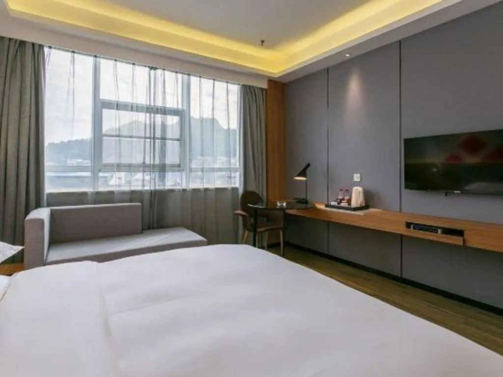 Bed in Borrman Hotel Hechi Bama Central Cultural Plaza