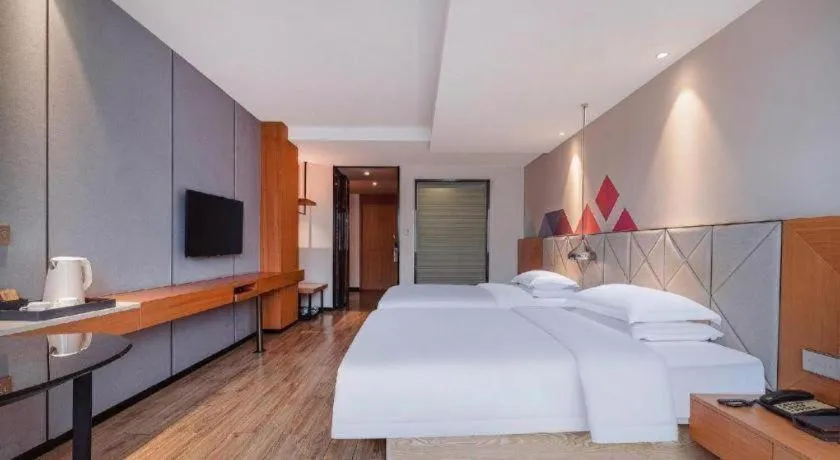 Bed in Borrman Hotel Hechi Bama Central Cultural Plaza