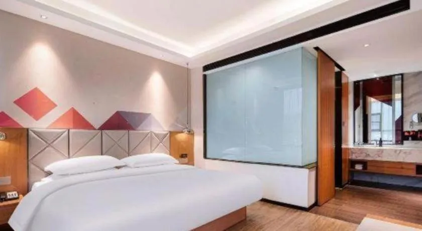 Bed in Borrman Hotel Hechi Bama Central Cultural Plaza