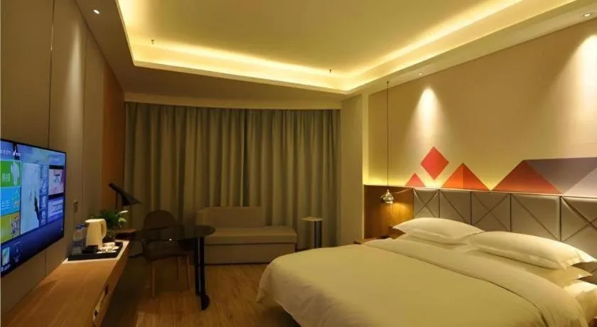 Bed in Borrman Hotel Hechi Bama Central Cultural Plaza