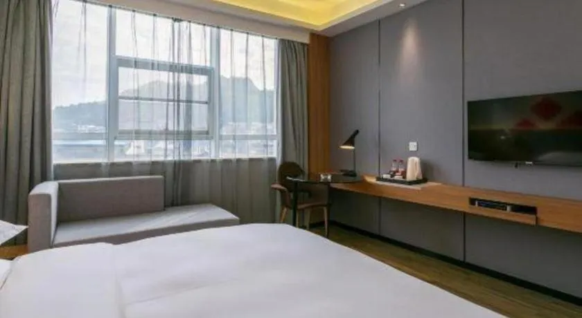 Bed in Borrman Hotel Hechi Bama Central Cultural Plaza