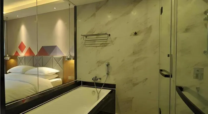 Bed in Borrman Hotel Hechi Bama Central Cultural Plaza