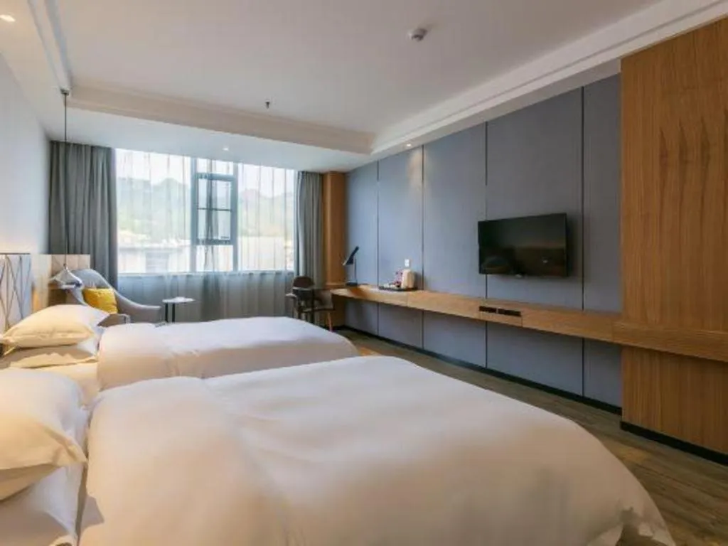 Bed in Borrman Hotel Hechi Bama Central Cultural Plaza