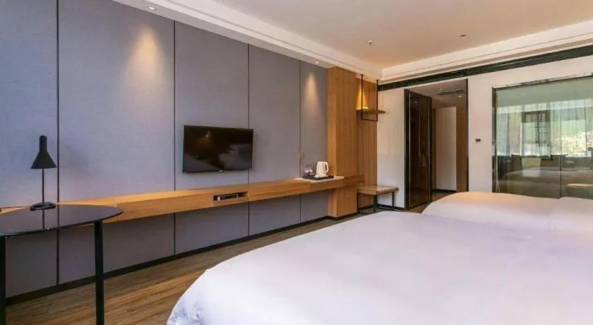 Bed in Borrman Hotel Hechi Bama Central Cultural Plaza