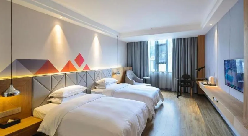 Bed in Borrman Hotel Hechi Bama Central Cultural Plaza