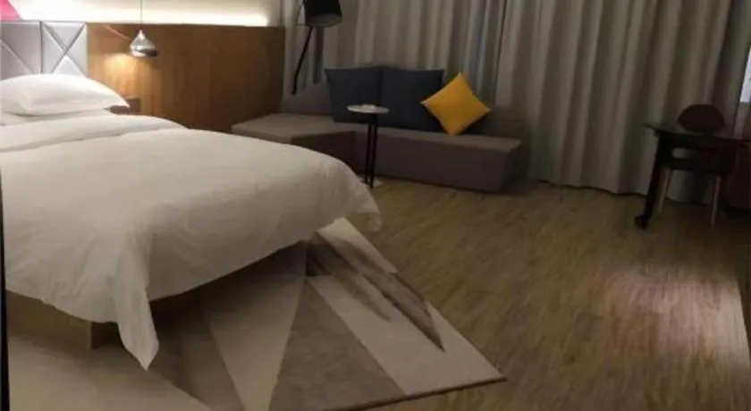 Bed in Borrman Hotel Hechi Bama Central Cultural Plaza