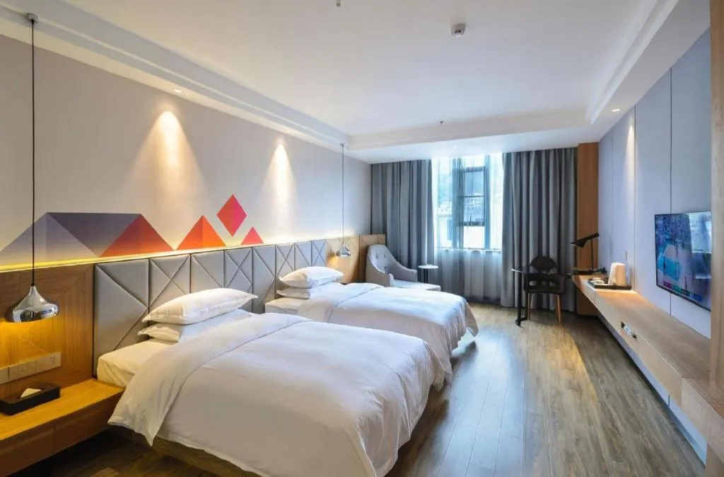 Bed in Borrman Hotel Hechi Bama Central Cultural Plaza