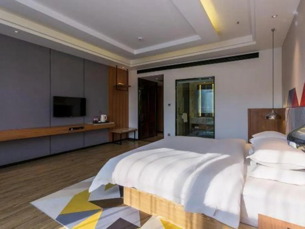 Bed in Borrman Hotel Hechi Bama Central Cultural Plaza