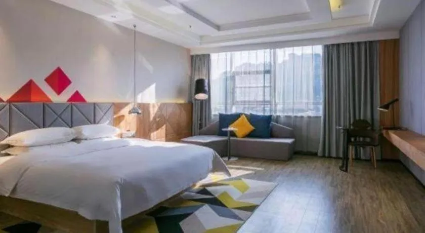 Bed in Borrman Hotel Hechi Bama Central Cultural Plaza