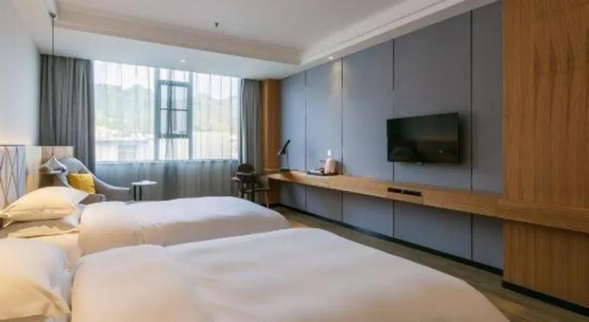 Bed in Borrman Hotel Hechi Bama Central Cultural Plaza